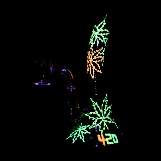 A colorful glow-in-the-dark dab rig with a 14mm banger joint