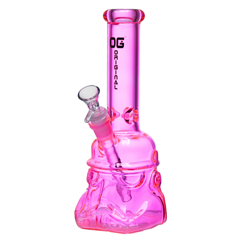 A pink glass water pipe with a Stormtrooper helmet design, featuring a clear glass bowl and a black 'OG ORIGINAL' logo printed on the neck, set against a plain white background. The Wee Smoke Shop