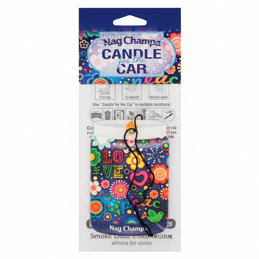 A Nag Champa 'Candle for the Car' smokeless incense stick holder, packaged in its original retail card packaging. The holder features a vibrant, multicolored bohemian-style design with the word 'LOVE' and the word 'peace' written in stylized fonts, surrounded by flowers, stars, and a green bird.