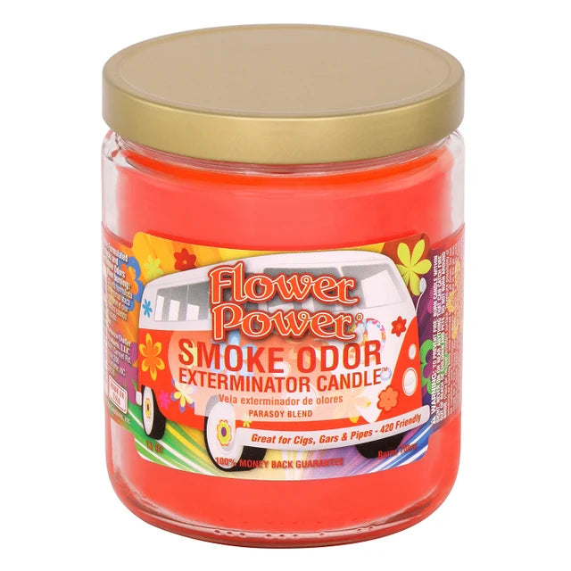 A jar candle labeled 'Flower Power Smoke Odor Exterminator Candle' with bright orange-red wax, a gold lid, and a colorful front label on a white background.