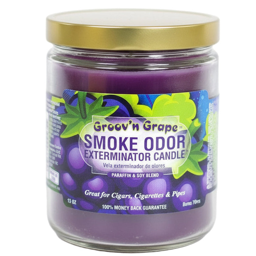 Purple candle jar with gold lid labeled 'Groov'n Grape Smoke Odor Exterminator Candle' on a white background - The Wee Smoke Shop