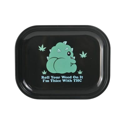 Black tray with green dinosaur graphic and text on a white background
