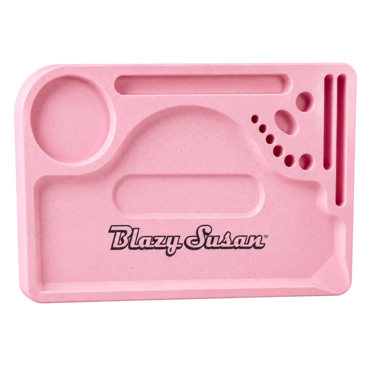 Pastel pink Blazy Susan rolling tray with a speckled finish, multiple built-in compartments, a large circular grinder holder, narrow slots, small circular accessory holders, and black Blazy Susan branding in the centre, shown from above on a white background.