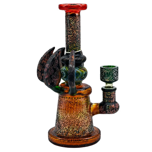 Decorative smoking accessory with intricate patterns on a white background