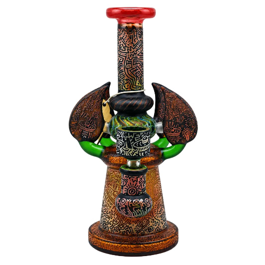 Decorative smoking accessory with intricate designs on a white background