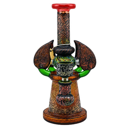 Decorative smoking accessory with intricate designs on a white background
