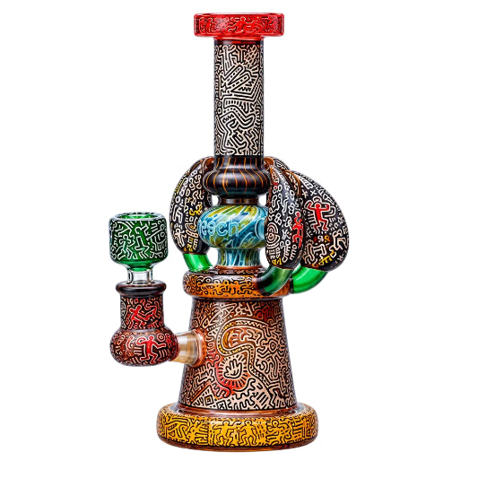 Decorative smoking pipe with intricate designs on a white background