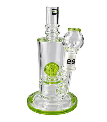 Clear glass water pipe with green base on a white background