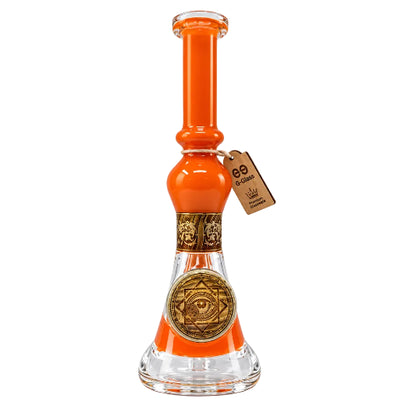 Glass smoking device with orange accent and decorative tag on a white background
