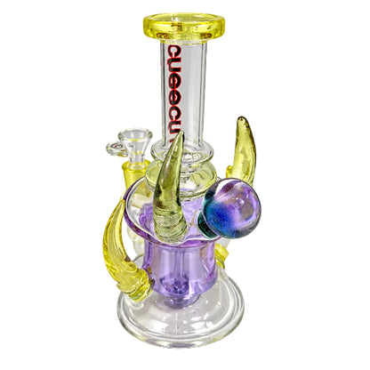 Glass smoking device with colorful features on a white background