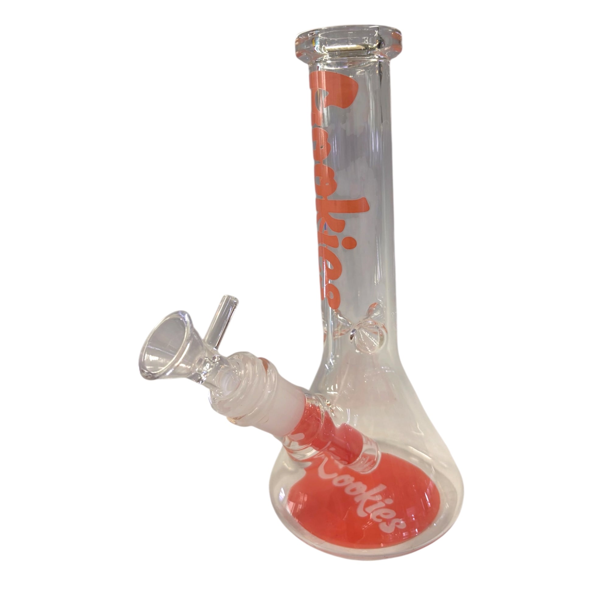 A clear glass water pipe with a peach/pink silicone base and peach/pink and white 'Cookies' branding, shown on a plain white background. - The Wee Smoke Shop