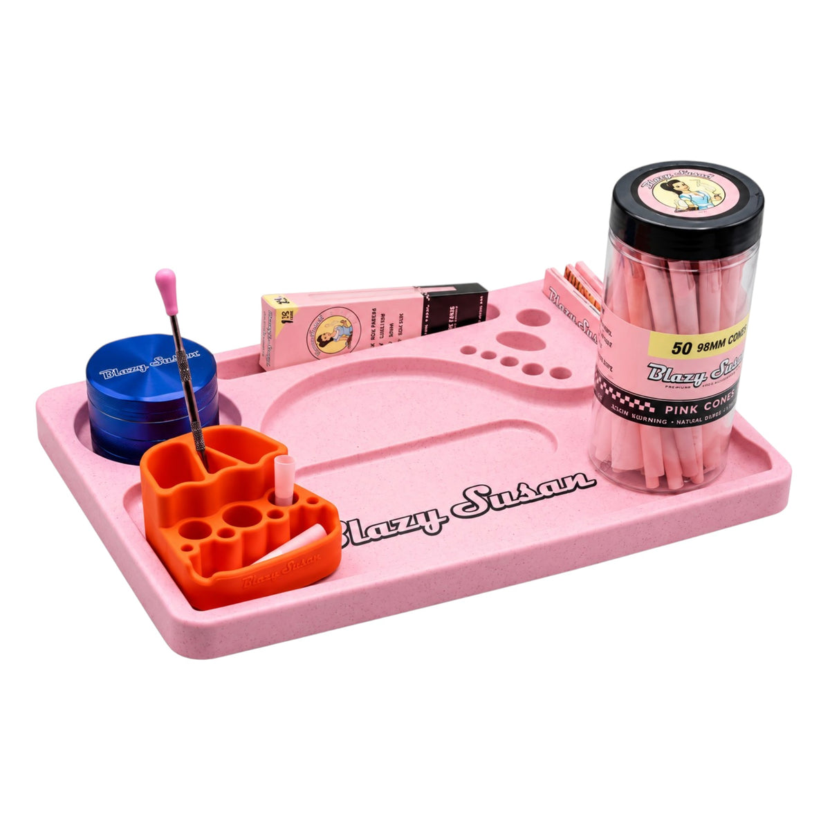 Pink Blazy Susan rolling tray with built-in compartments, featuring a blue grinder, orange accessory holder, pink rolling papers, and a clear container of pink pre-rolled cones. Black Blazy Susan branding is visible on the tray.