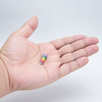Hand holding a small filter tips with rainbow design and 'ELEMENTS' branding.