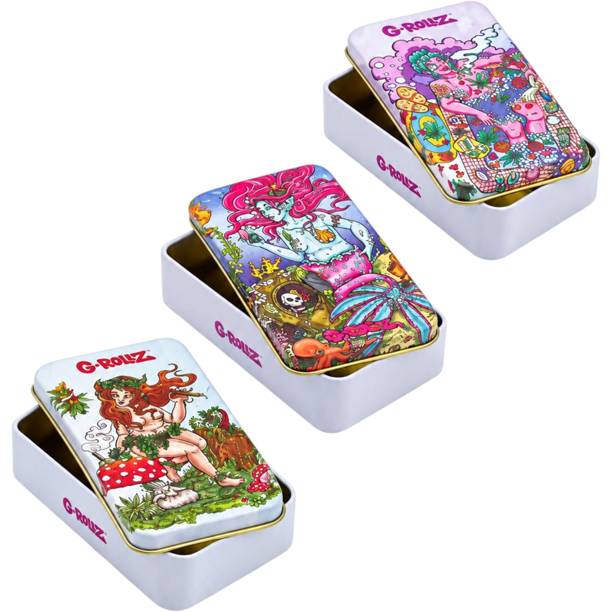 Three G-Rollz rectangular metal storage tins with colourful illustrated lids, shown partially open on a white background. Designs feature a psychedelic fantasy scene, a woodland fairy, and a pink-haired mermaid. 