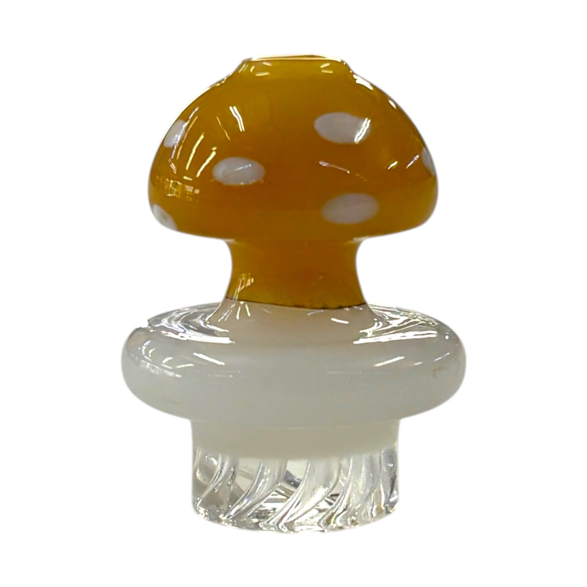 Gold mushroom dab carb cap with white spots, glossy glass top, and clear textured base.