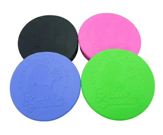 Four round silicone coasters in black, pink, blue, and green with 'Green Goddess' branding on a white background.
