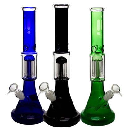 Three 14 inch coloured glass beaker bongs shown together in blue, black, and green, each with a matching coloured neck and base, clear percolator chamber, angled bowl, and downstem. The Wee Smoke Shop