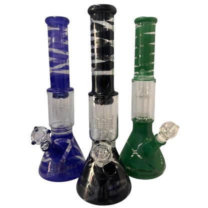 Three spiral stripe glass beaker bongs shown together in blue, black, and green, each with a matching coloured neck, beaker base, clear percolator chamber, angled bowl, and downstem. The Wee Smoke Shop