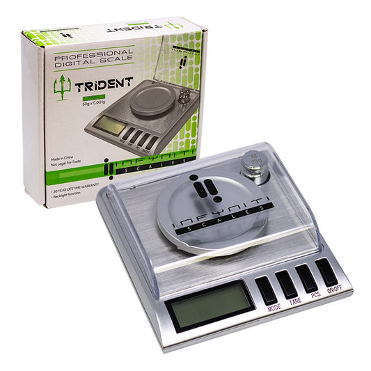 Infyniti Trident 50g digital scale with 0.001g accuracy, stainless steel platform, clear cover, weigh tray, calibration weight, and product box. - The Wee Smoke Shop