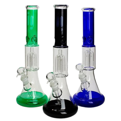 Three 14 inch glass beaker bongs shown together in green, black, and blue colour options, each with a coloured mouthpiece tube, matching beaker base, clear percolator chamber, angled bowl, and downstem. The Wee Smoke Shop