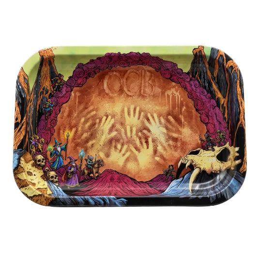 A rectangular rolling tray with rounded corners, featuring a highly detailed psychedelic illustration. The design shows a large orange and yellow central circle with handprints and the letters 'OCB', surrounded by a purple border, with dark brown and black tree-like silhouettes and a skull on a blue and yellow background.