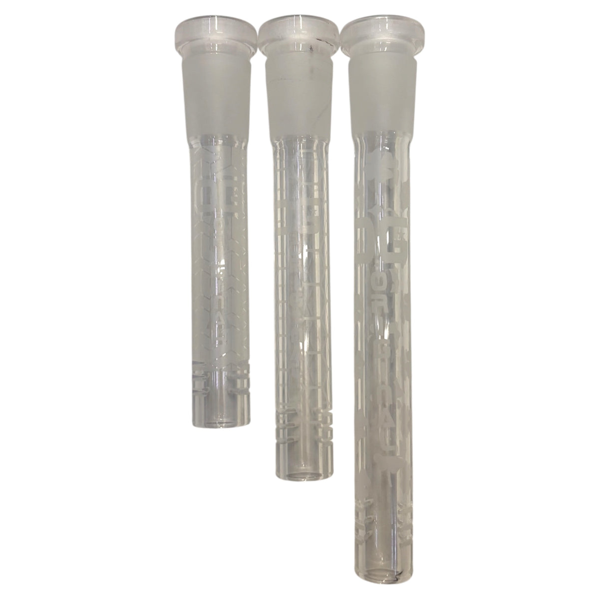Three clear OG glass downstems in assorted lengths, featuring frosted glass joints, etched Prism, Honeycomb, and Clover patterns, and slotted diffuser ends on a white background. 