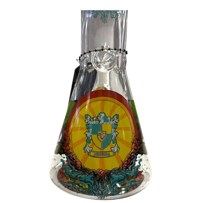 Close-up of Phoenix Star glass beaker bong base with colourful crest artwork, clear glass body, and decorative printed design. - The Wee Smoke Shop