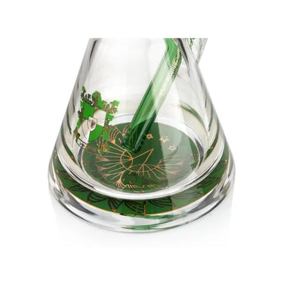 Glass object with green and gold design on a white background