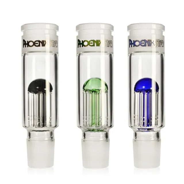 Three glass smoking accessories with colored tops on a white background