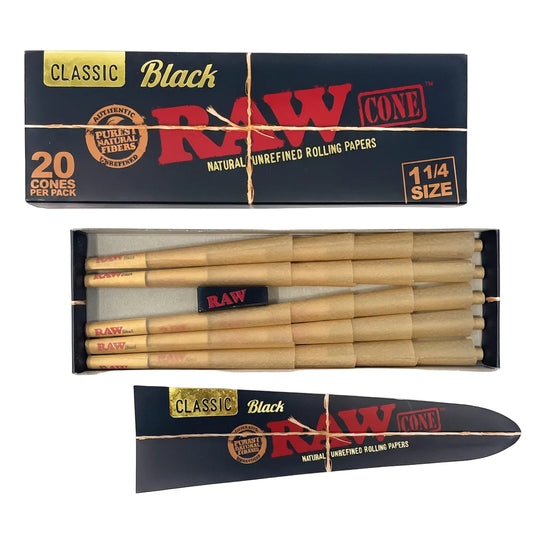 Box of Raw black rolling cones with cones inside on a white background