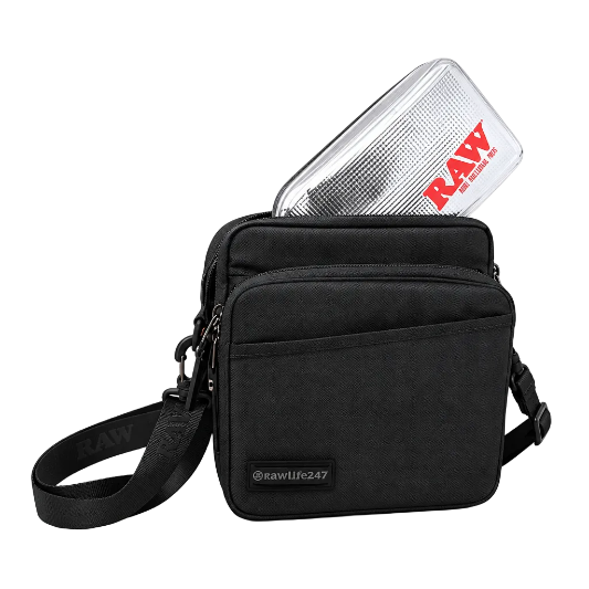 A black and brown RAW x Rolling Papers Day Bag with a cork top and a foil-sealed bag-in-a-bag, featuring Velcro-swappable patches and multiple compartments.