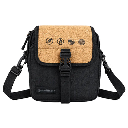 A black and brown RAW x Rolling Papers Day Bag with a cork top and a foil-sealed bag-in-a-bag, featuring Velcro-swappable patches and multiple compartments.