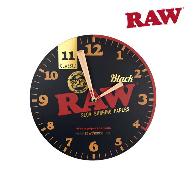 RAW Black wall clock with gold numbers and hands, featuring large RAW logo and “Black” design on a round face. - The Wee Smoke Shop