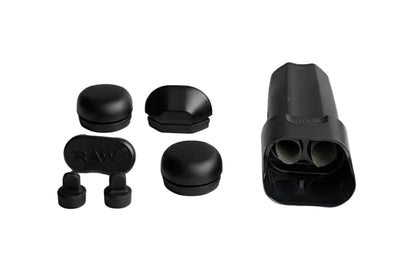 Black RAW smoking accessories including a large container, cap, and small components on a white background.
