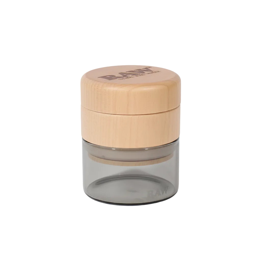 Glass jar with a wooden lid on a white background