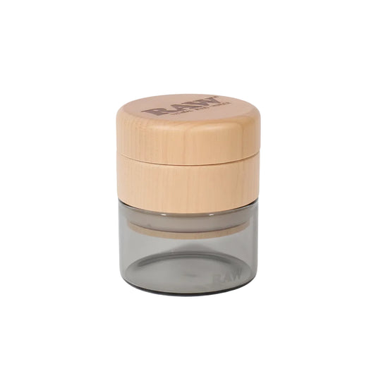 Glass jar with a wooden lid on a white background