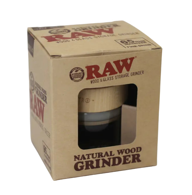 RAW natural wood grinder in a cardboard box on a white background