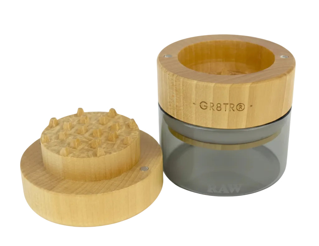 Two wooden Grinder with a clear glass jar on a white background, featuring the brand 'GR8TR'.