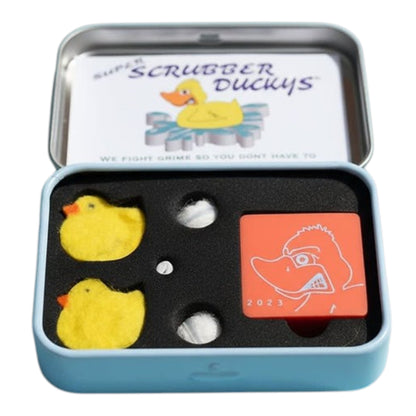 Open Scrubber Duckys magnetic cleaning kit in a light blue carrying case with two yellow duck-shaped scrubbers, white mini scrubber pieces, and an orange magnetic handle inside black foam packaging. - The Wee Smoke Shop