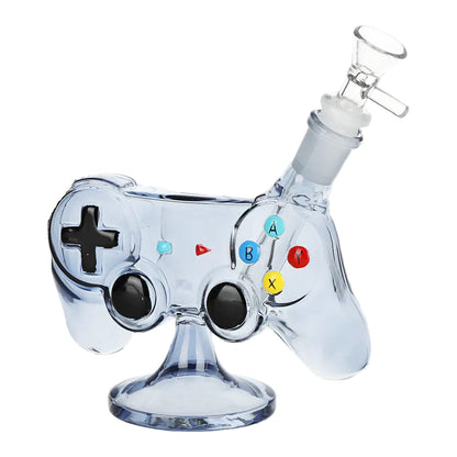 Clear blue game controller bong with black joysticks, coloured buttons, glass bowl, and pedestal base. The Wee Smoke Shop