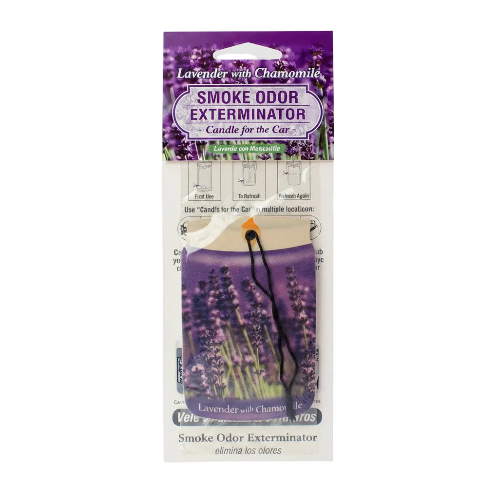 A packaged lavender and chamomile smoke odor exterminator candle for cars, featuring a purple illustrated header card and a visible lavender flower candle inside.