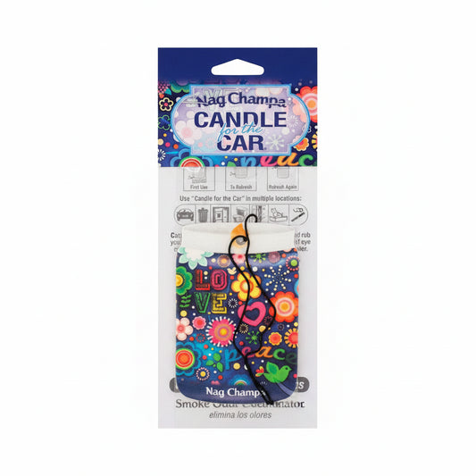 A Nag Champa 'Candle for the Car' smokeless incense stick holder, packaged in its original retail card packaging. The holder features a vibrant, multicolored bohemian-style design with the word 'LOVE' and the word 'peace' written in stylized fonts, surrounded by flowers, stars, and a green bird.