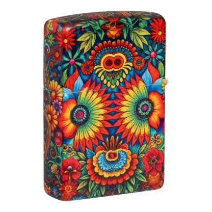 Back of the Zippo 360 Colourful Skull lighter featuring a symmetrical floral design with large multicoloured sunflower-like blossoms, red and blue flowers, green leaves, and a small owl-like face near the top. The vibrant artwork covers the entire back and continues around the sides.