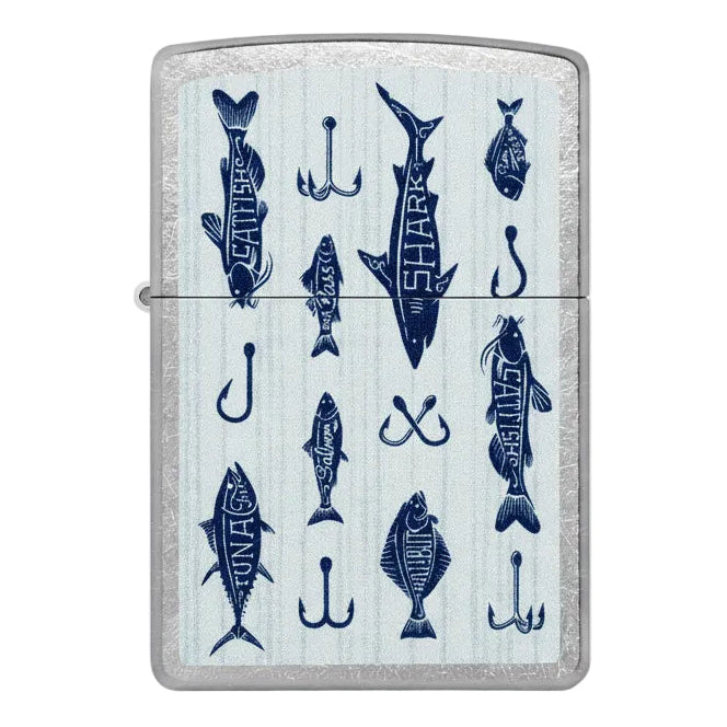 Brushed chrome Zippo-style lighter featuring a blue fishing-themed design with various fish species and hooks on a light background - The Wee Smoke Shop