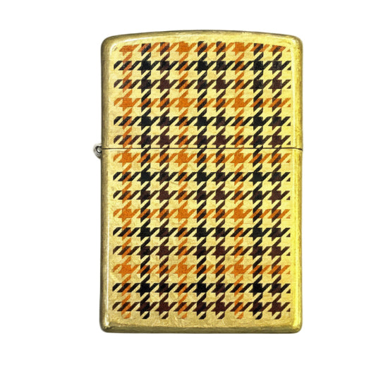 Gold lighter with plaid pattern on a white background