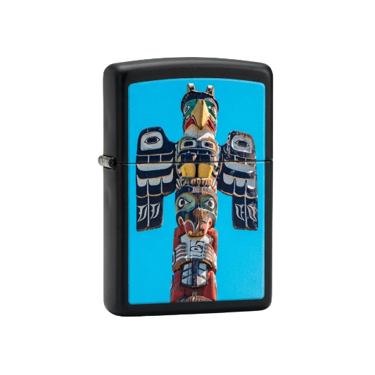 A Zippo lighter with a black background featuring a handcrafted totem pole design with colorful figures.