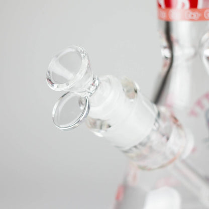 Close-up of a clear glass bottle with a white label on a light gray background