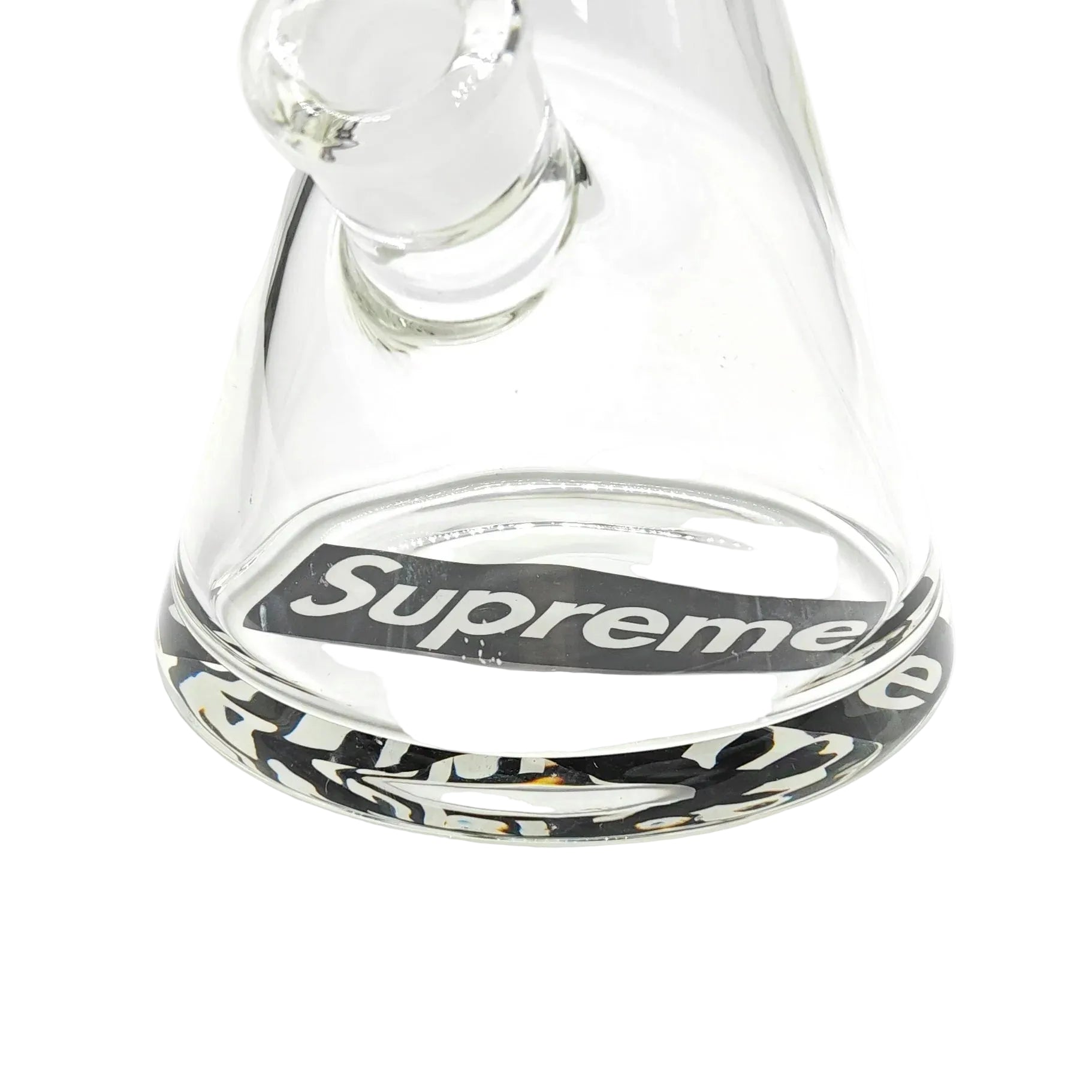 Clear glass water pipe with 'Supreme' logo on a white background