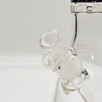 Close-up of a glass water pipe with a white background