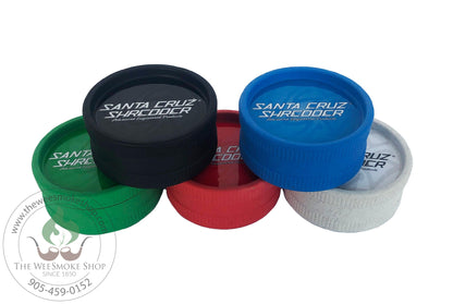 Four 2 part Grinders, Black and Blue on top and Green, Red and White on the bottom